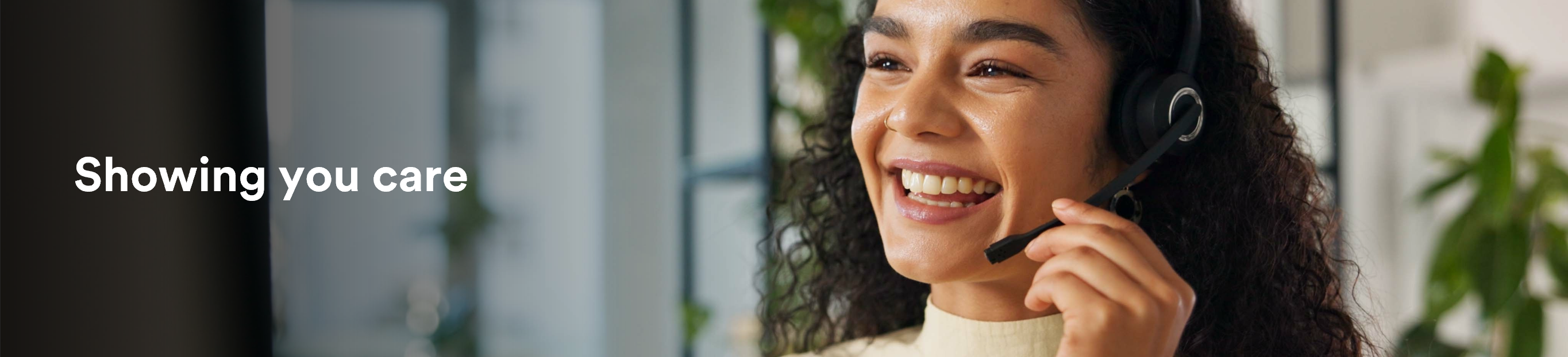 Showing you care - Smiling representative with headset, next to the text "Showing you care"